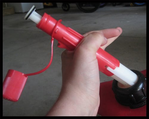 Twist the sleeve until it aligns with the plastic piece on the bottom half of the nozzle. 