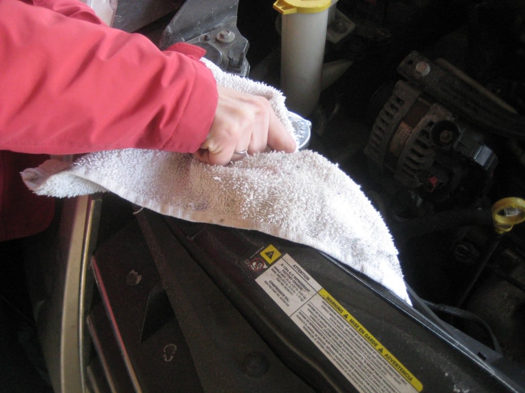 Use towel to remove the cap - overheating car