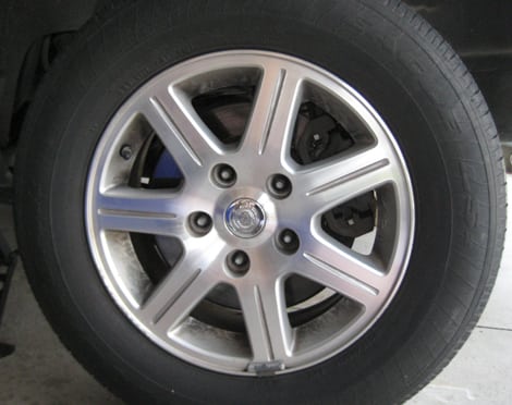 Remove each lug nut and place them in a safe place - change a tire