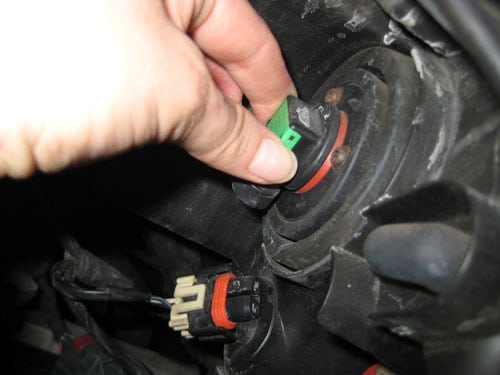 Disconnect the wiring and the bulb - change a headlight 